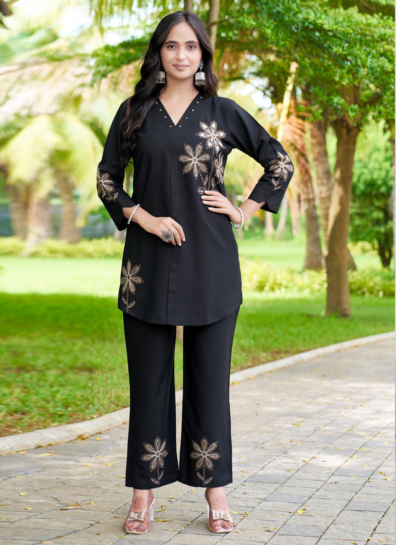 Black rayon co-ords set with intricate multi-color embroidery thread work and straight-cut pants.