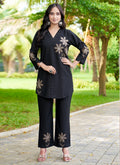 Black rayon co-ords set with intricate multi-color embroidery thread work and straight-cut pants.