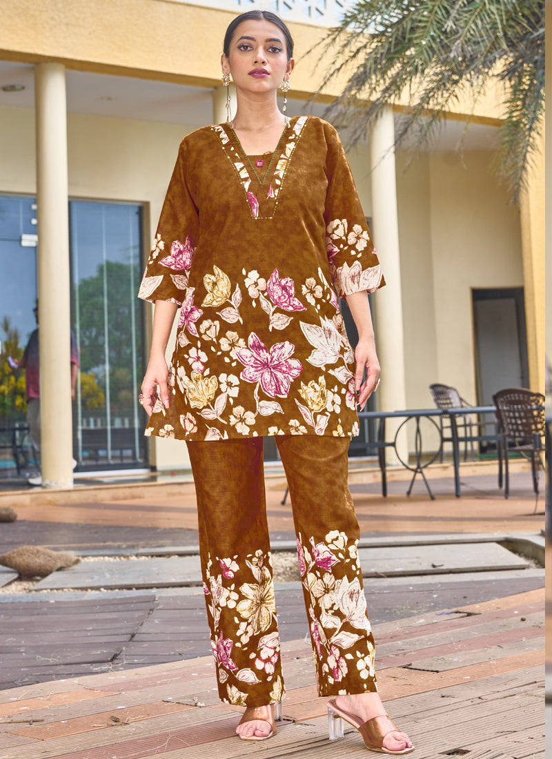 Mustard pure cotton co-ord set featuring stylish prints and handwork detail on the neckline.