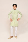 Pastel green cotton kurta paired with white art silk straight fit pants