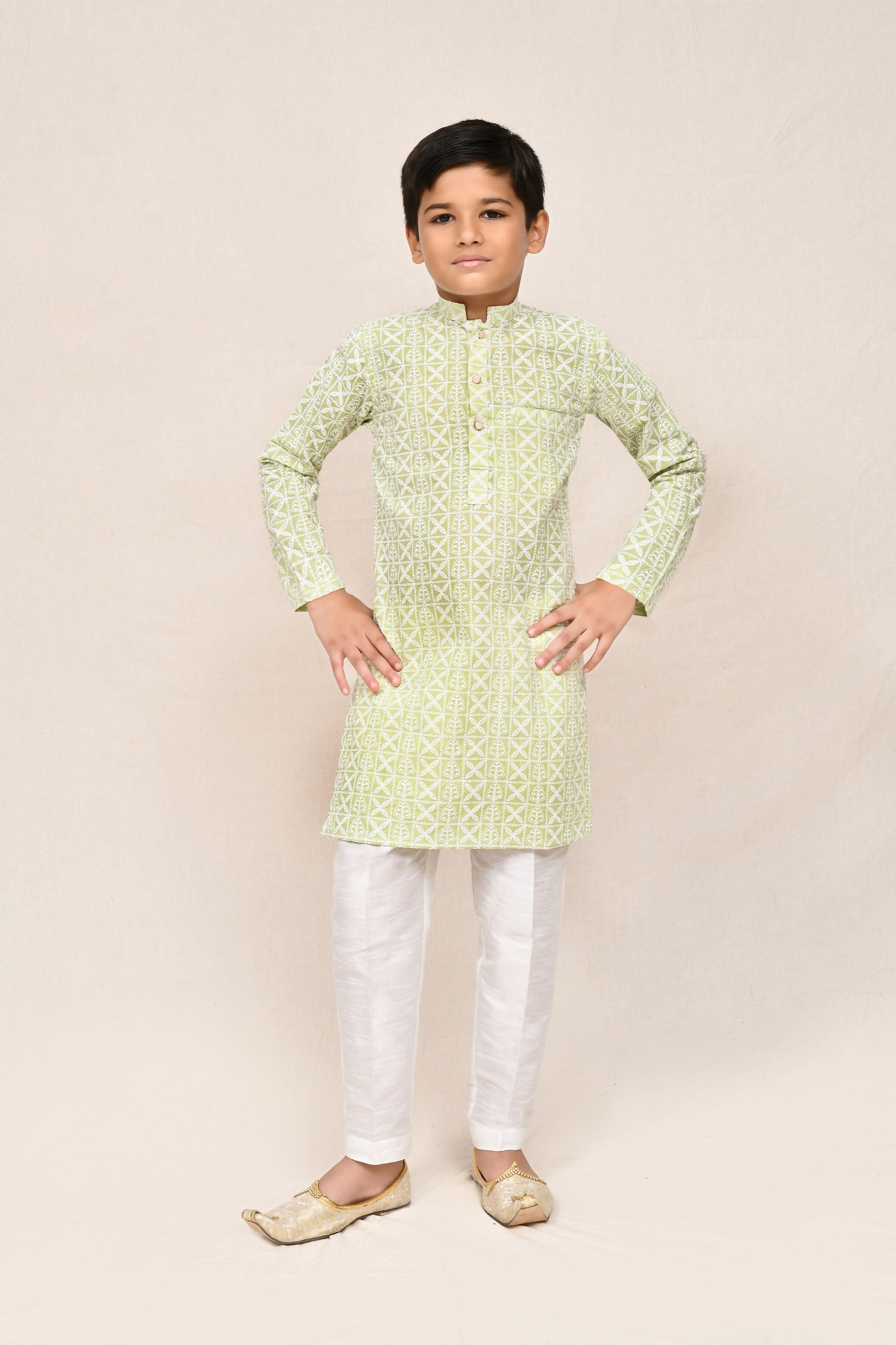 Pastel green cotton kurta paired with white art silk straight fit pants