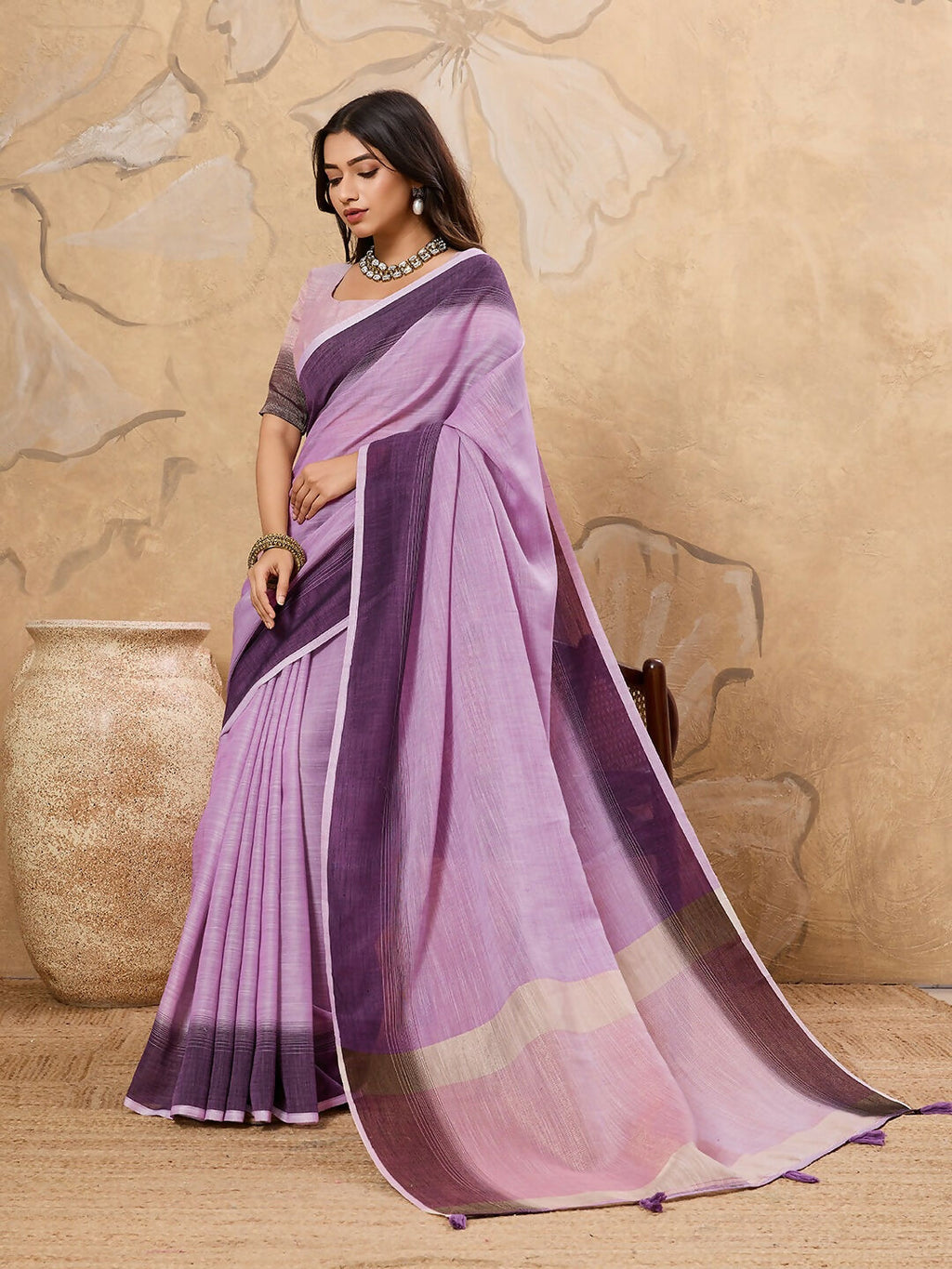 Purple linen saree featuring a matching purple blouse for a monochromatic look