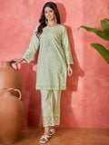 Model wearing a green pure cotton embroidered co-ord set with 3/4 sleeves