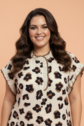 Leopard print button-down blouse with frilled details in cream, brown, and black.