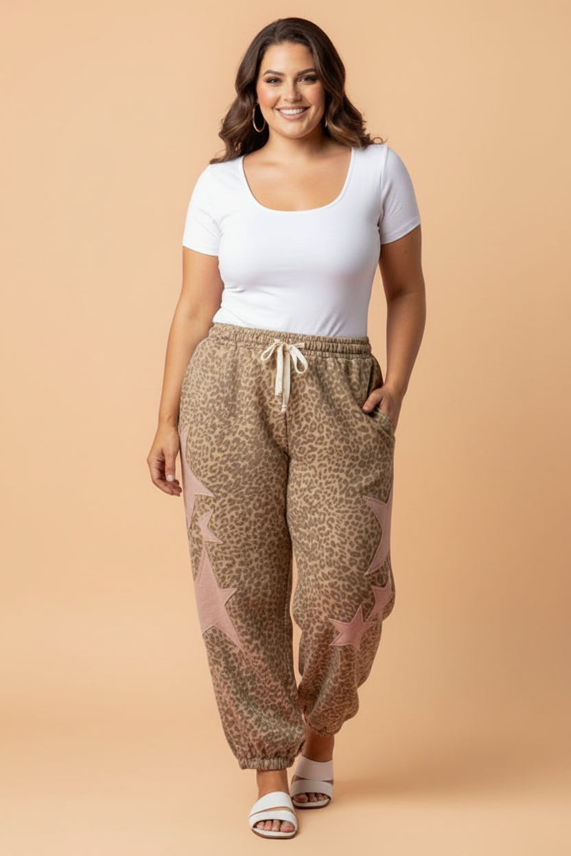 Women wearing leopard print jogger pants with star patches in shades of brown, tan, and blush-pink.