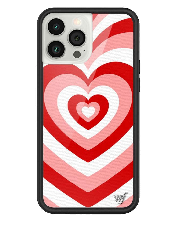 iPhone case featuring a repeating red, pink, and white heart pattern with a black protective bumper.
