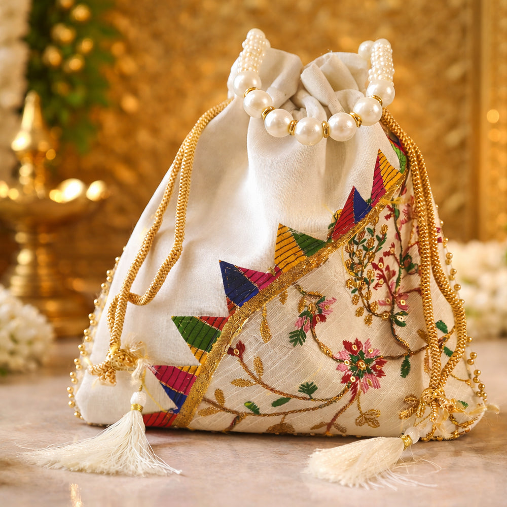 Handcrafted silk potli bag with intricate gold embroidery and pearl bead handle