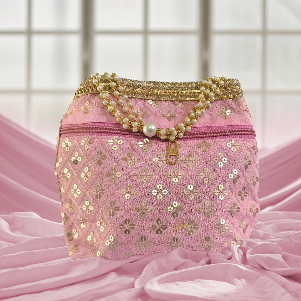 Silk brocade potli bag with pearl borders, beaded handles, and intricate embroidery for wedding occasions