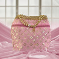 Silk brocade potli bag with pearl borders, beaded handles, and intricate embroidery for wedding occasions