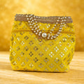 Luxurious silk brocade wedding potli bag with pearl borders and beaded handles