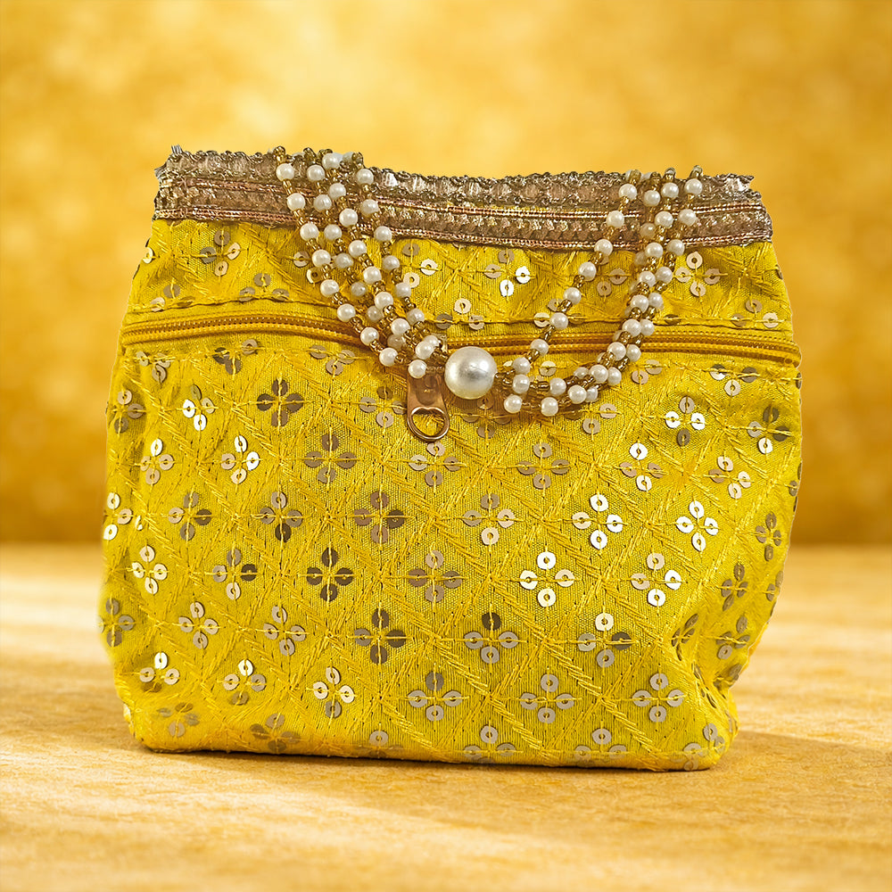 Luxurious silk brocade wedding potli bag with pearl borders and beaded handles