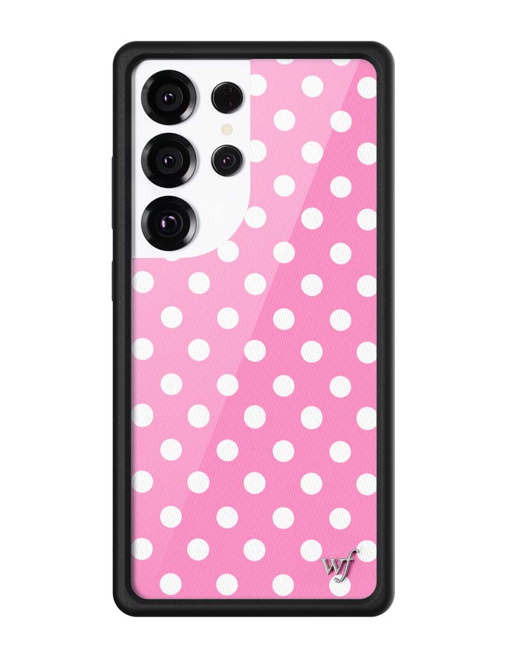 Samsung Galaxy phone case with a bright pink background and white polka dot pattern with black bumper