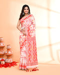 Woman wearing an elegant off-white and red cotton silk Jamdani saree with traditional patterns
