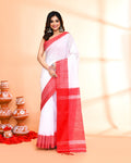 White cotton silk handloom saree with matching blouse piece draped elegantly.