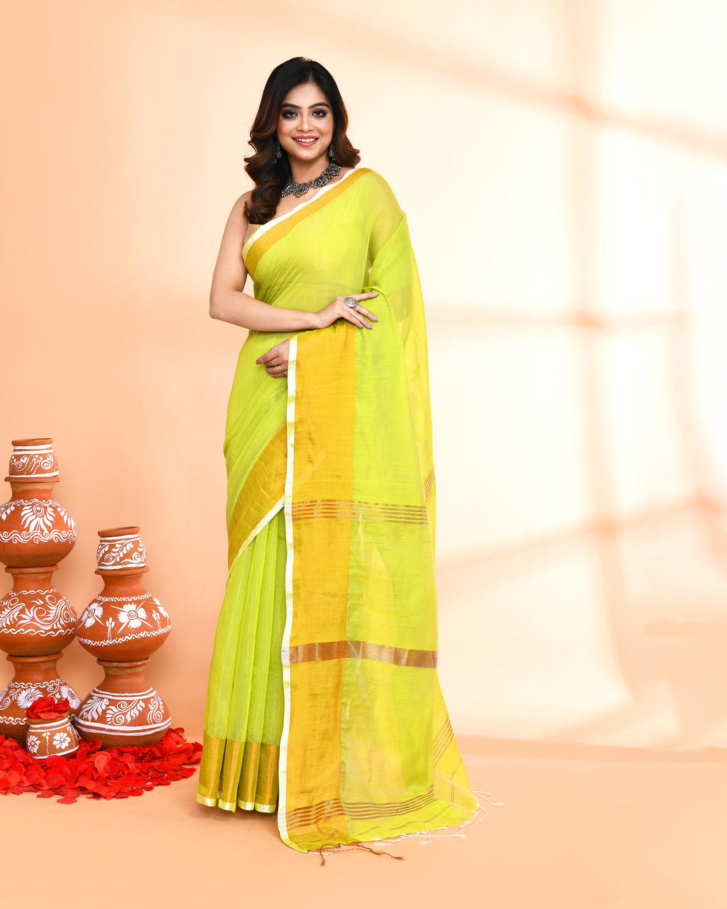 Lemon yellow cotton silk handloom saree with gold trim and matching blouse.