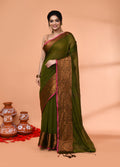Moss green handloom cotton blend saree with matching blouse piece draped elegantly