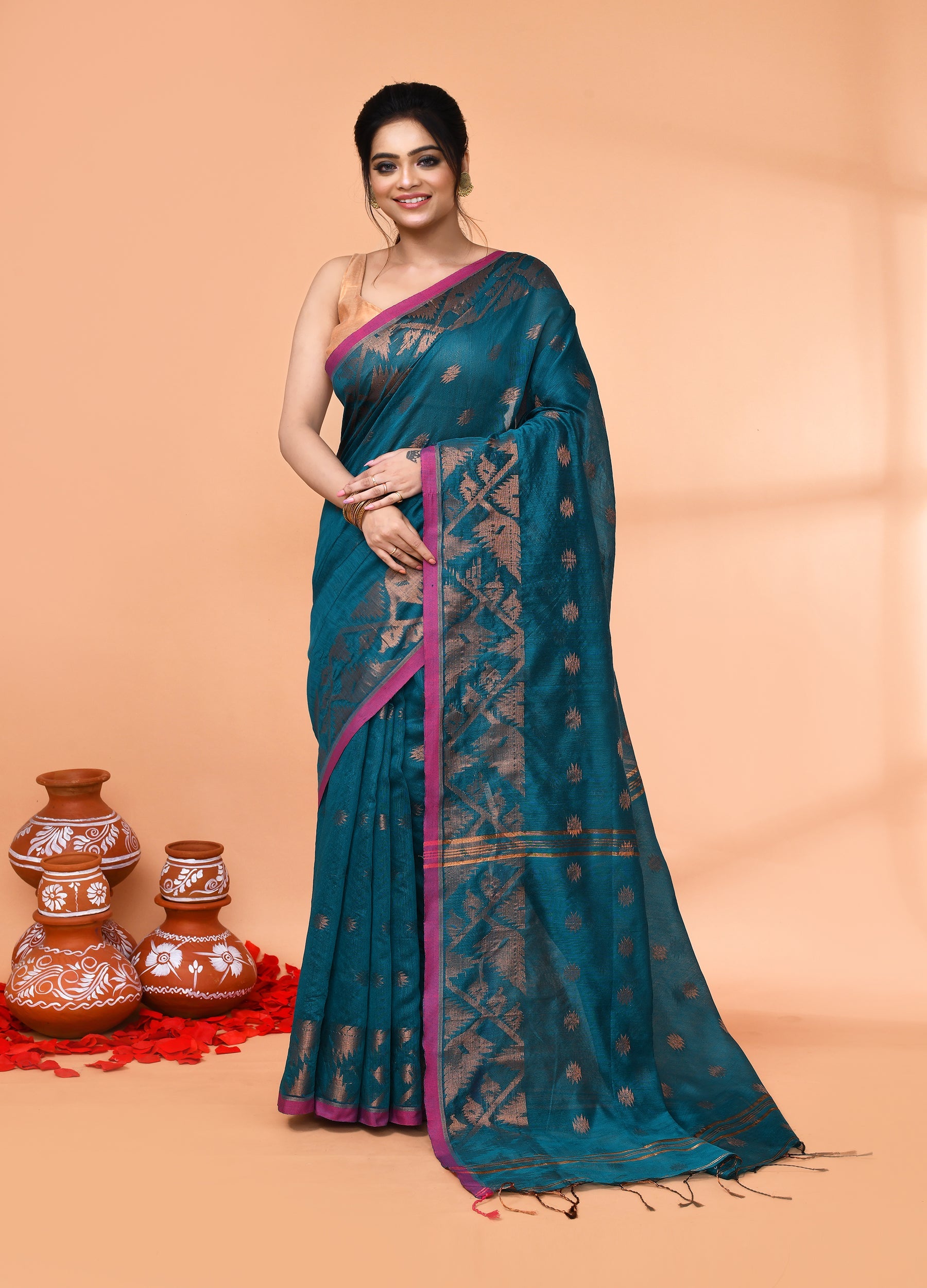 Teal handloom cotton blend saree featuring a smooth drape and included blouse piece