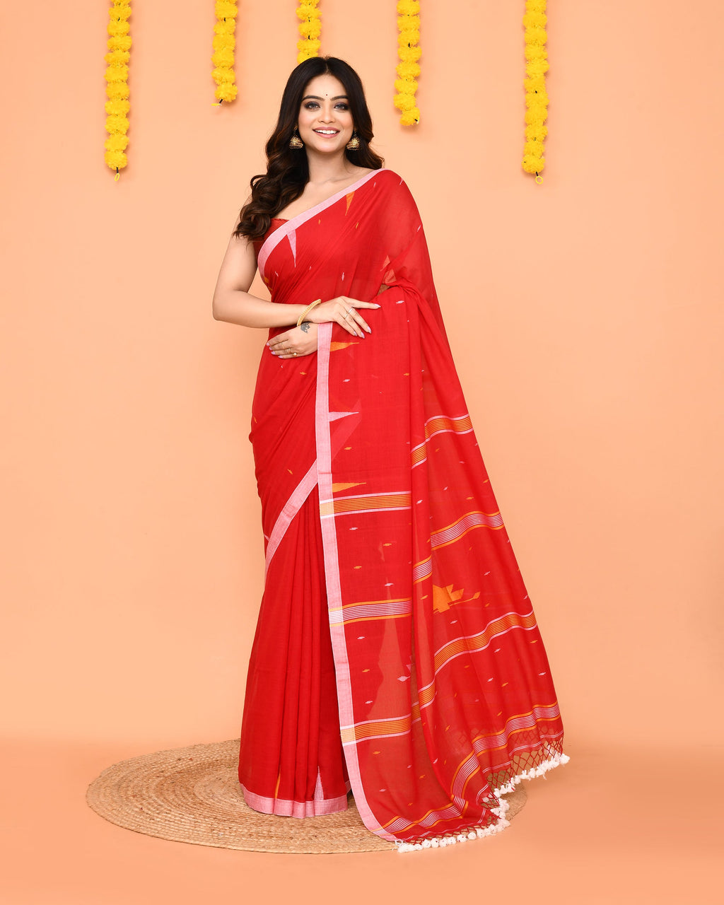 Beautiful red soft mul cotton Jamdani saree with delicate net tassels.