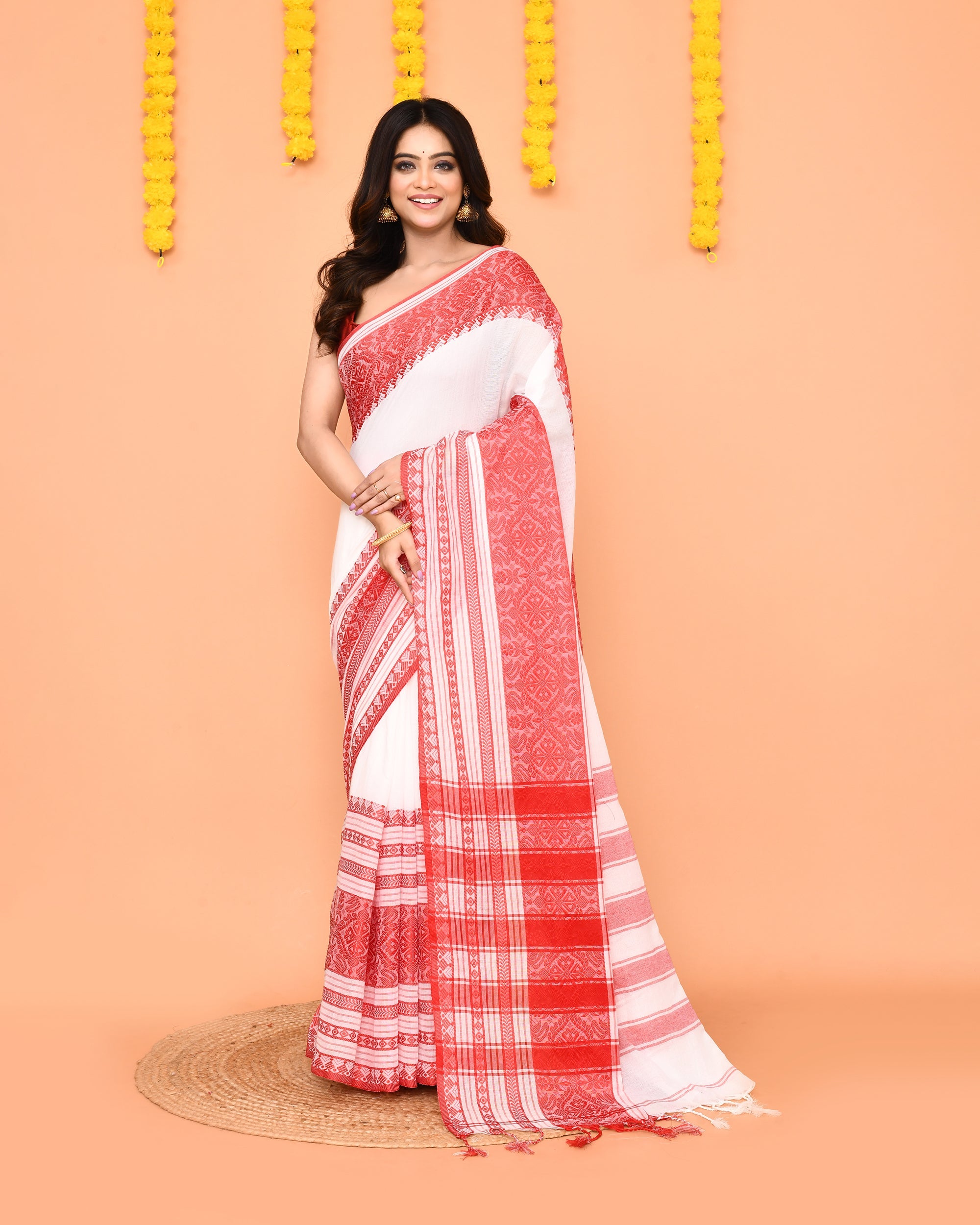 White handloom Jamdani cotton saree with intricate woven patterns
