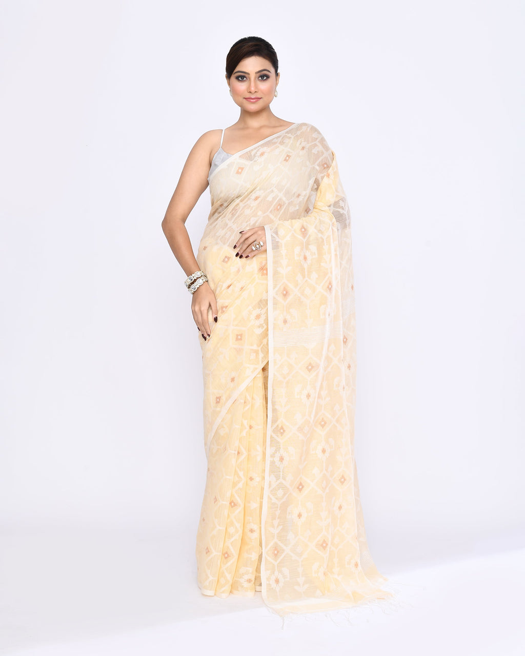 Cream colored embellished Jamdani cotton blend saree