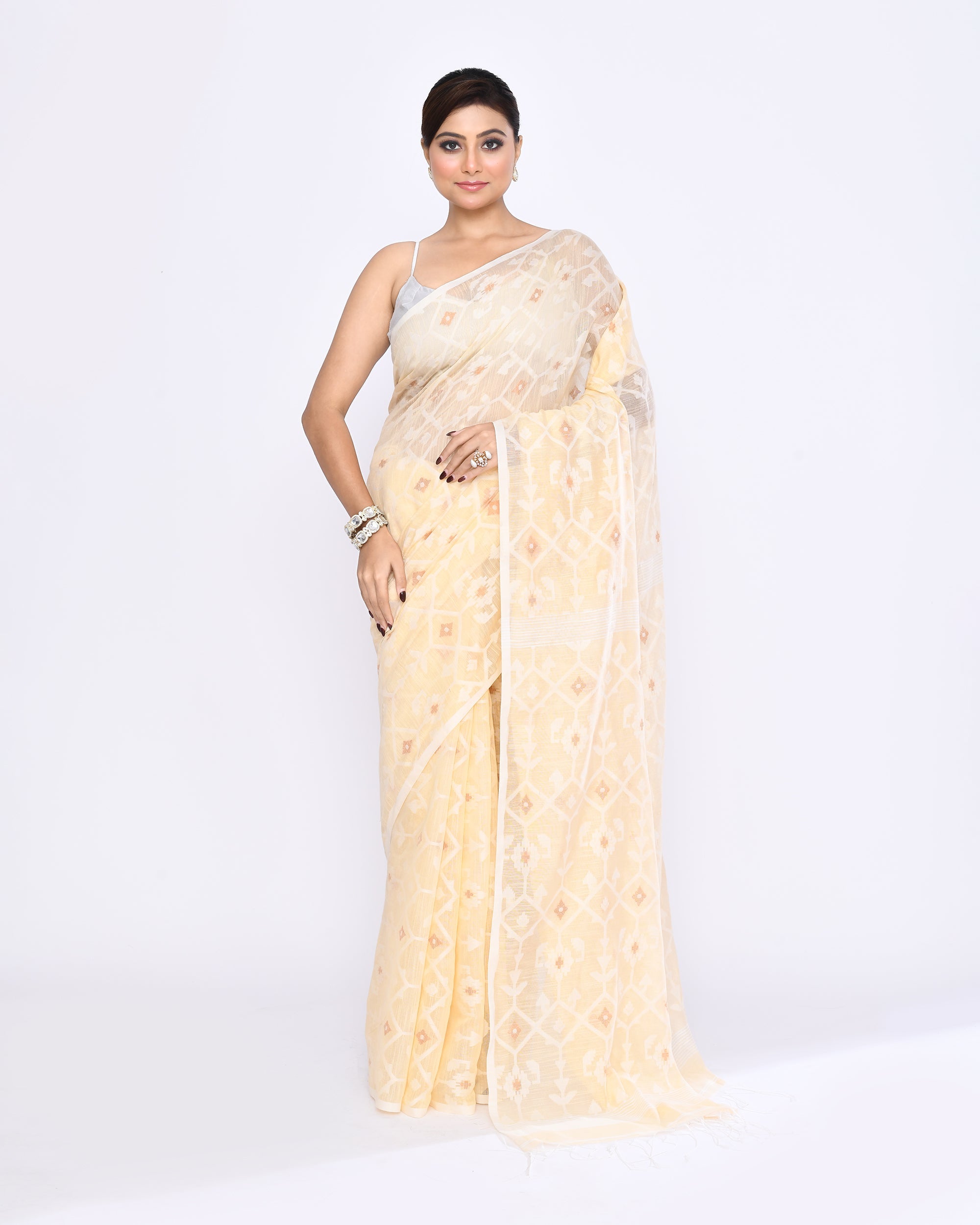 Cream colored embellished Jamdani cotton blend saree