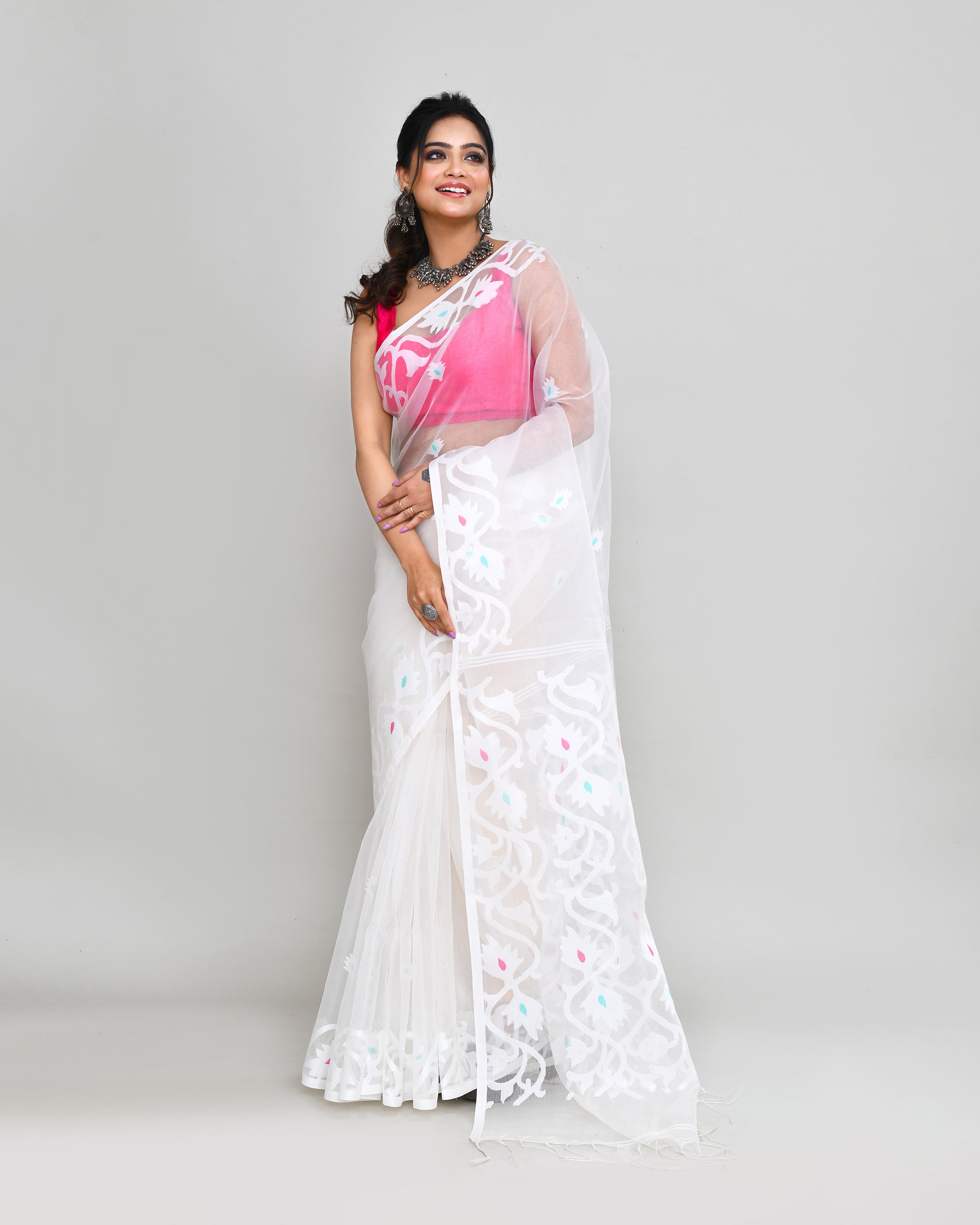 Elegant white art silk Jamdani saree with intricate hand work and matching blouse piece