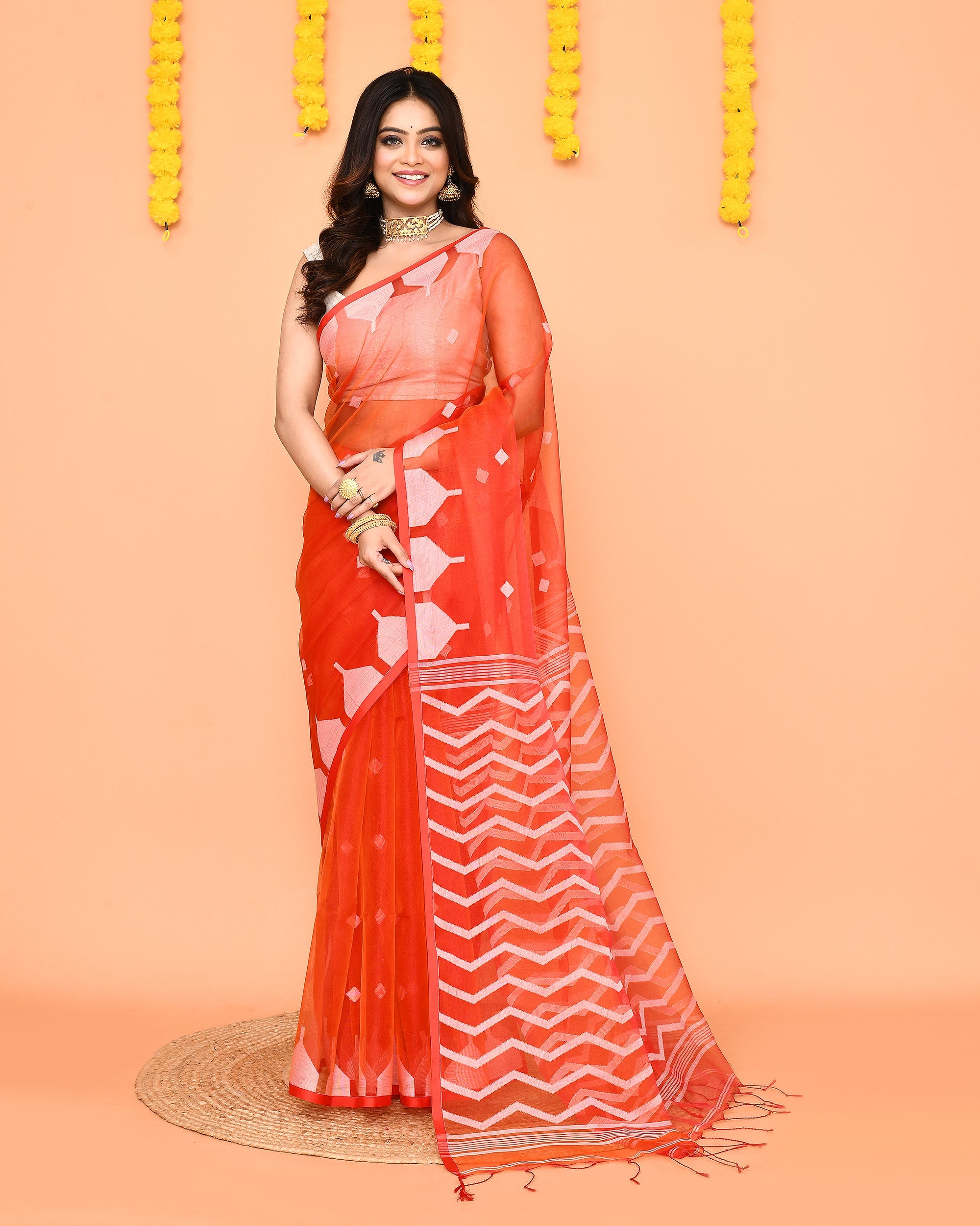 Orange Resham silk Jamdani saree with vibrant red border