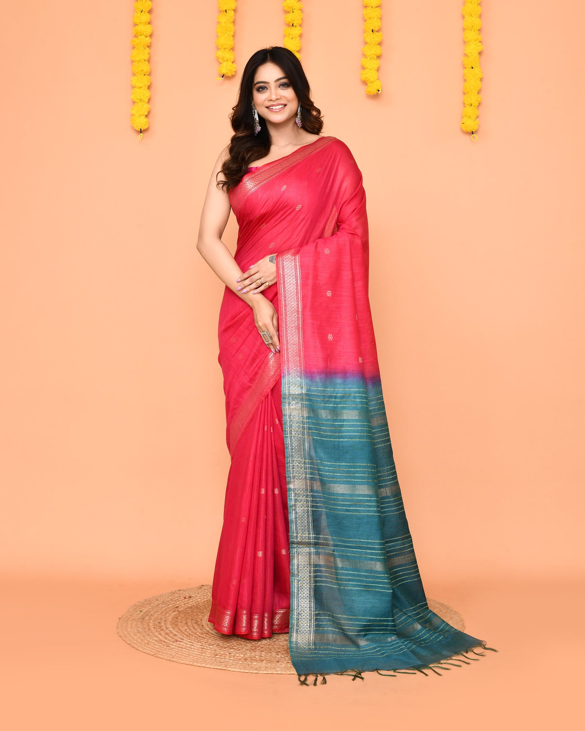 Rani-colored handloom blend silk saree with a traditional zari border.