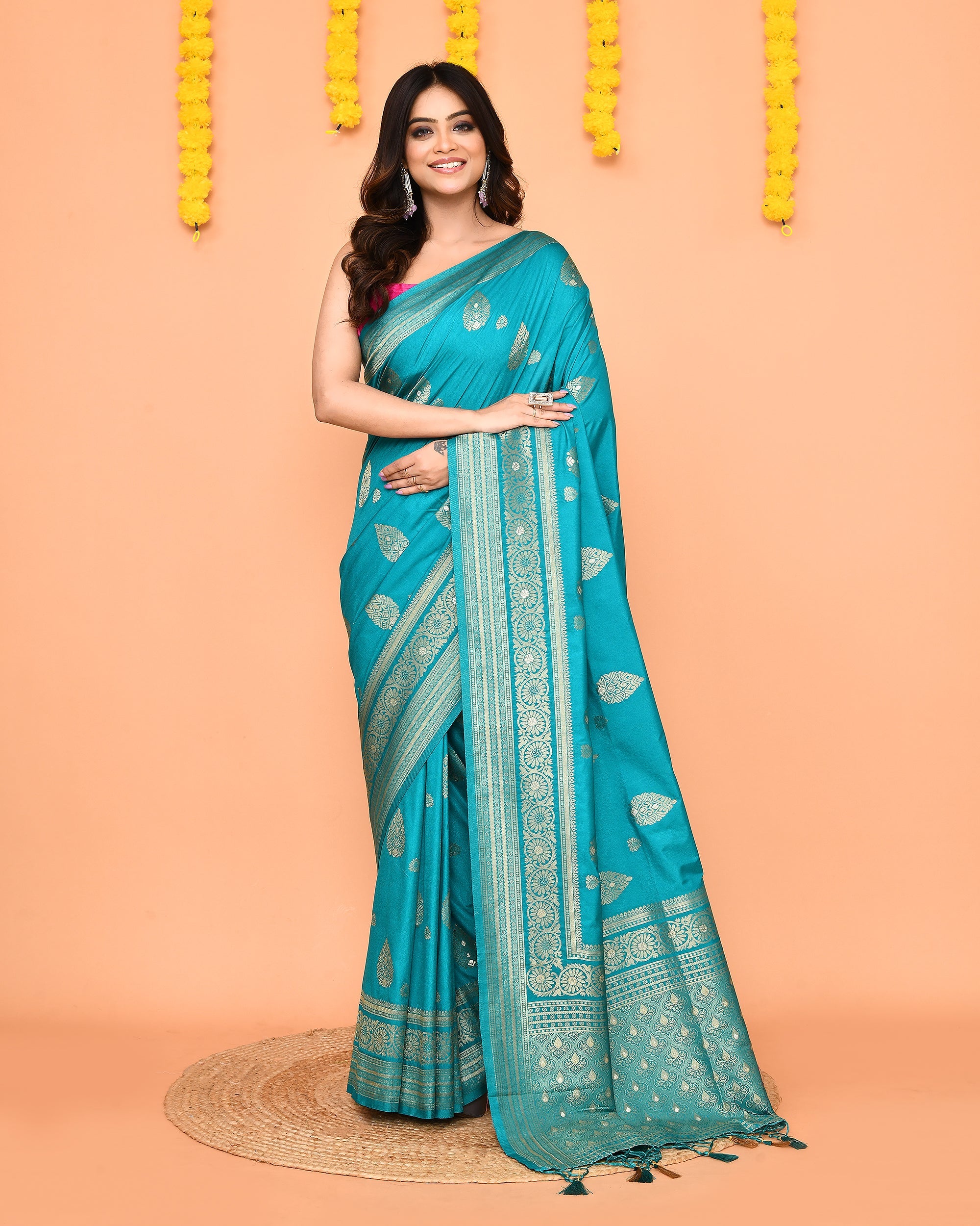 Turquoise Bangalore silk saree featuring an ornate gold Zari border and delicate Jamdani details.