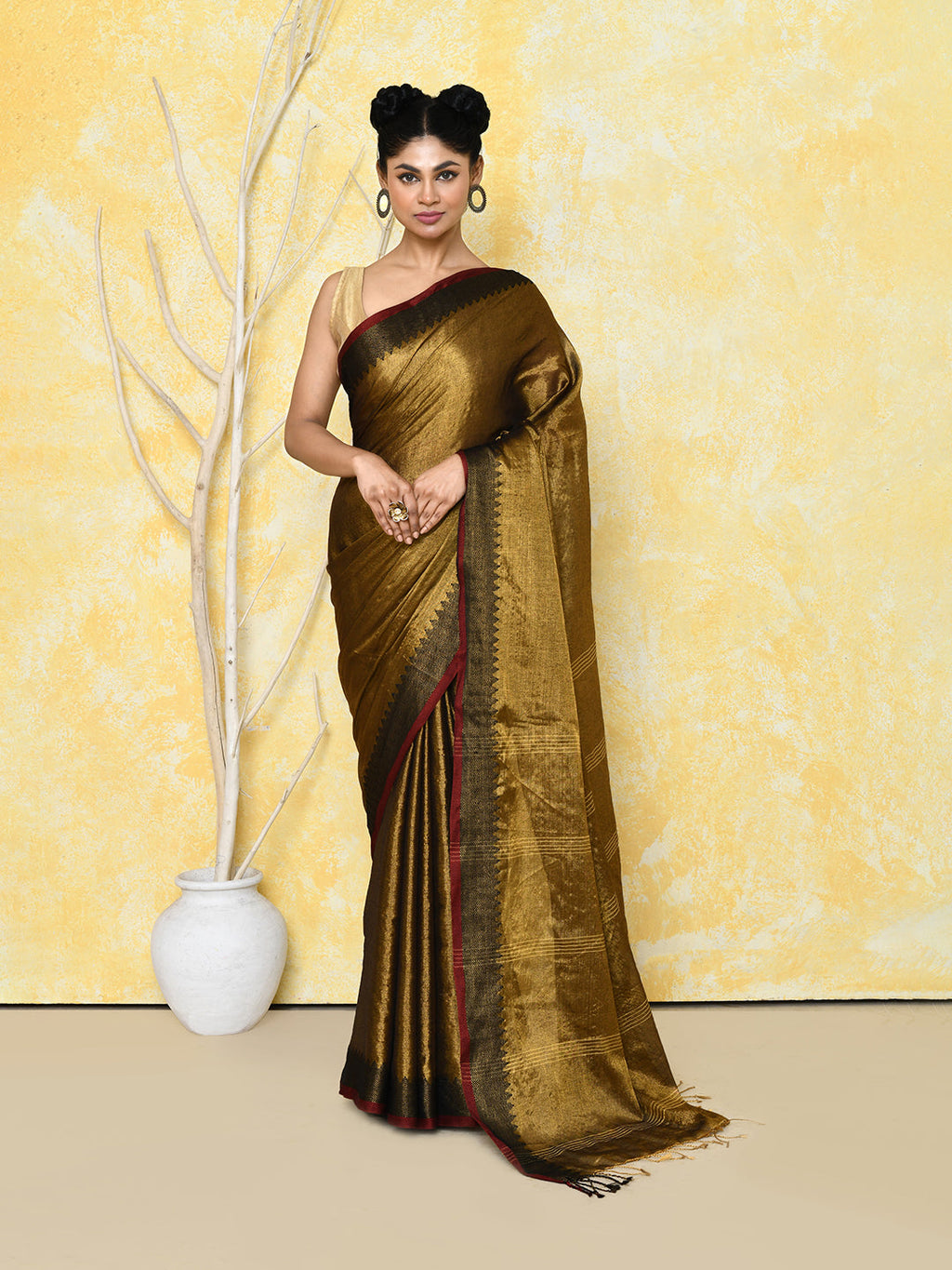 Shimmering gold organic tissue saree, elegant choice for wedding events.