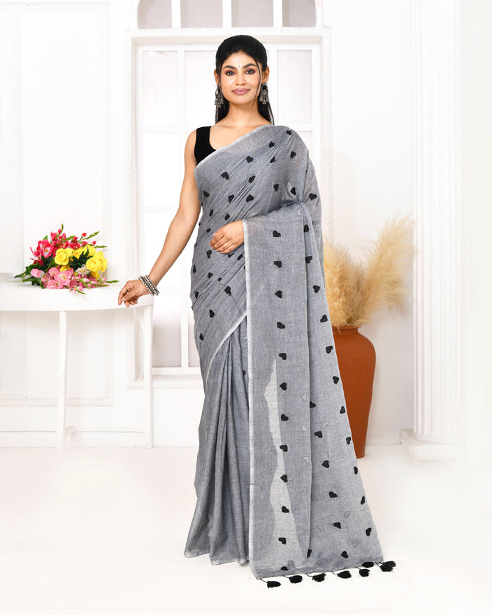 Elegant grey handspun cotton saree with intricate embroidery detailing.