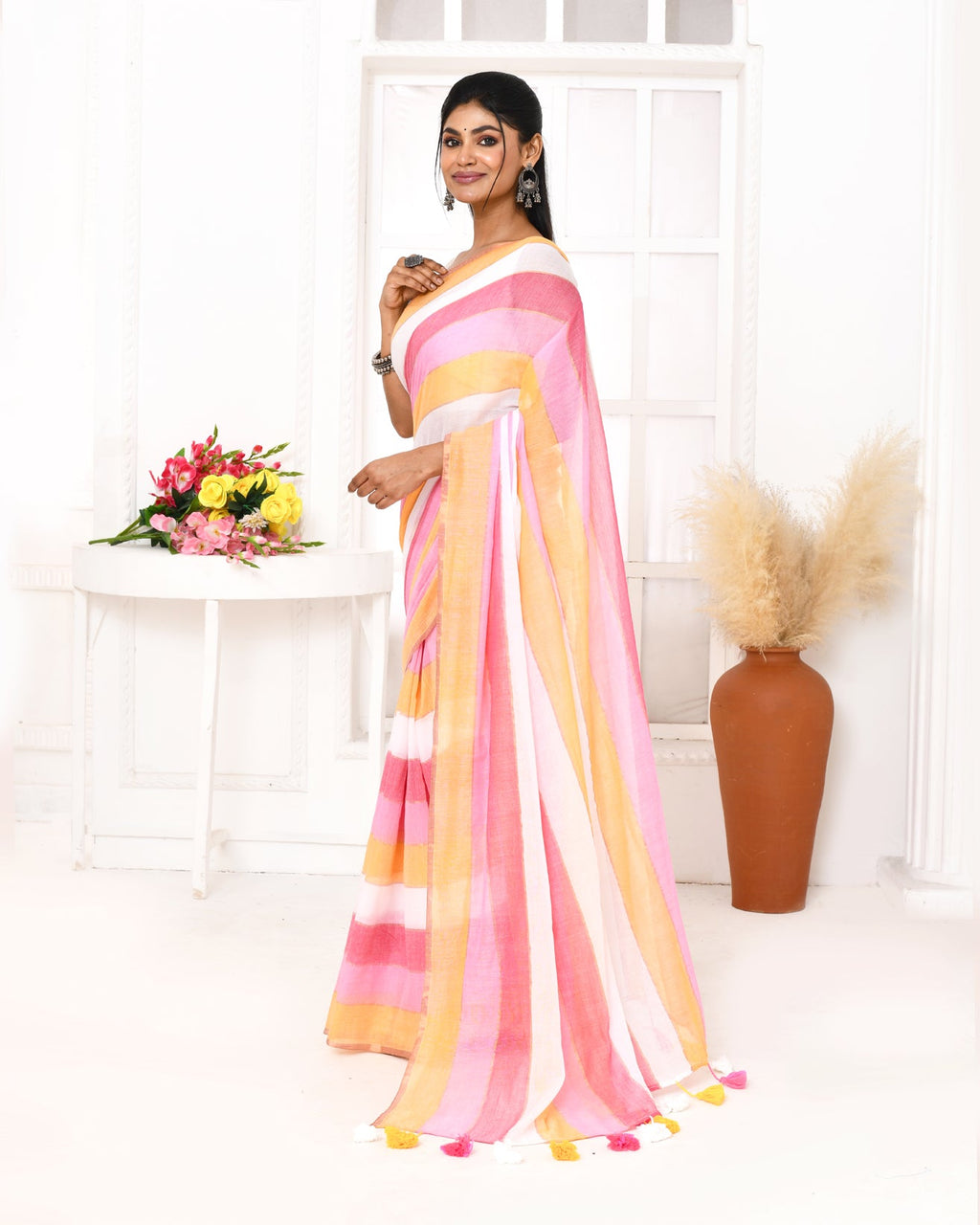 Pink striped Mulmul cotton saree with decorative tassel detailing