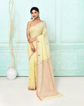 Cream cotton handloom Jamdani saree with intricate woven patterns and matching blouse.