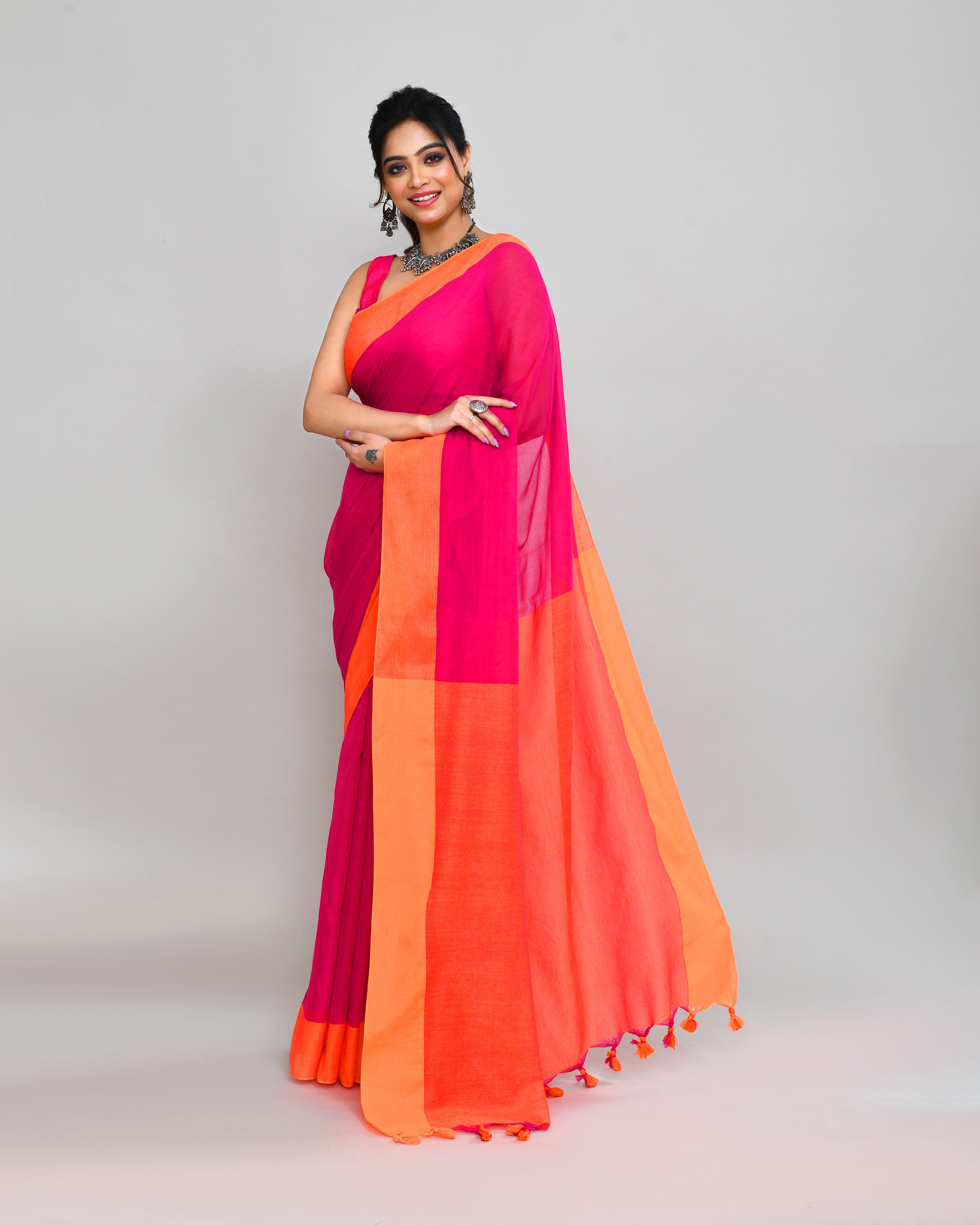 Rani Pink Cotton Saree with Orange Border and Tassel Detail