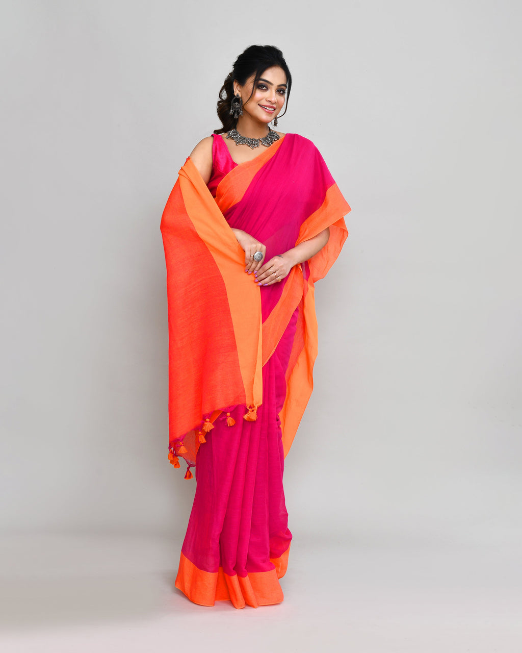 Rani Pink Cotton Saree with Orange Border and Tassel Detail