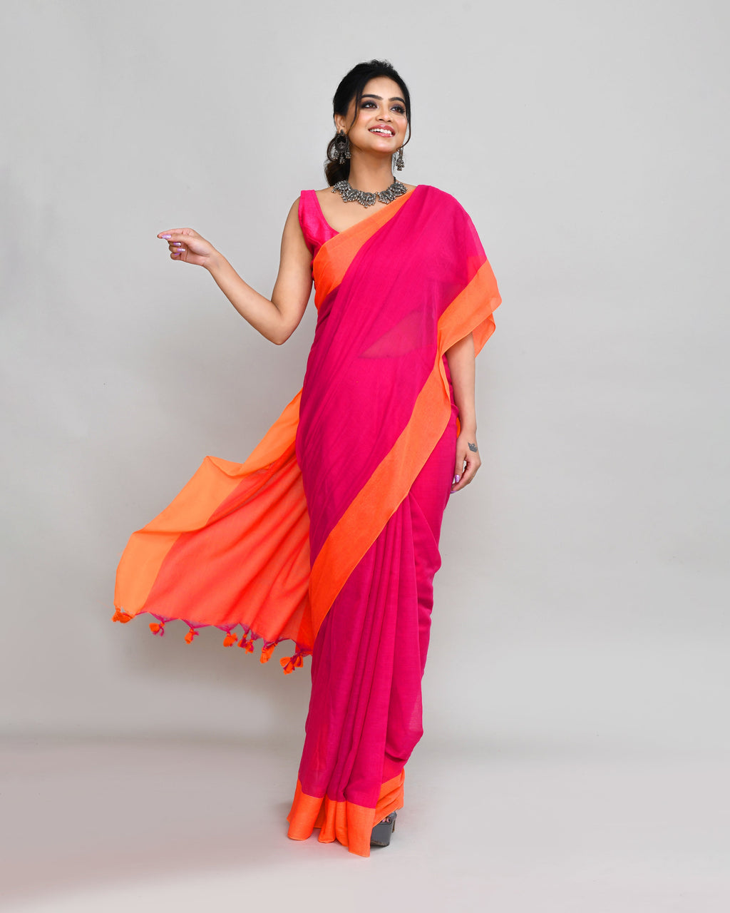 Rani Pink Cotton Saree with Orange Border and Tassel Detail
