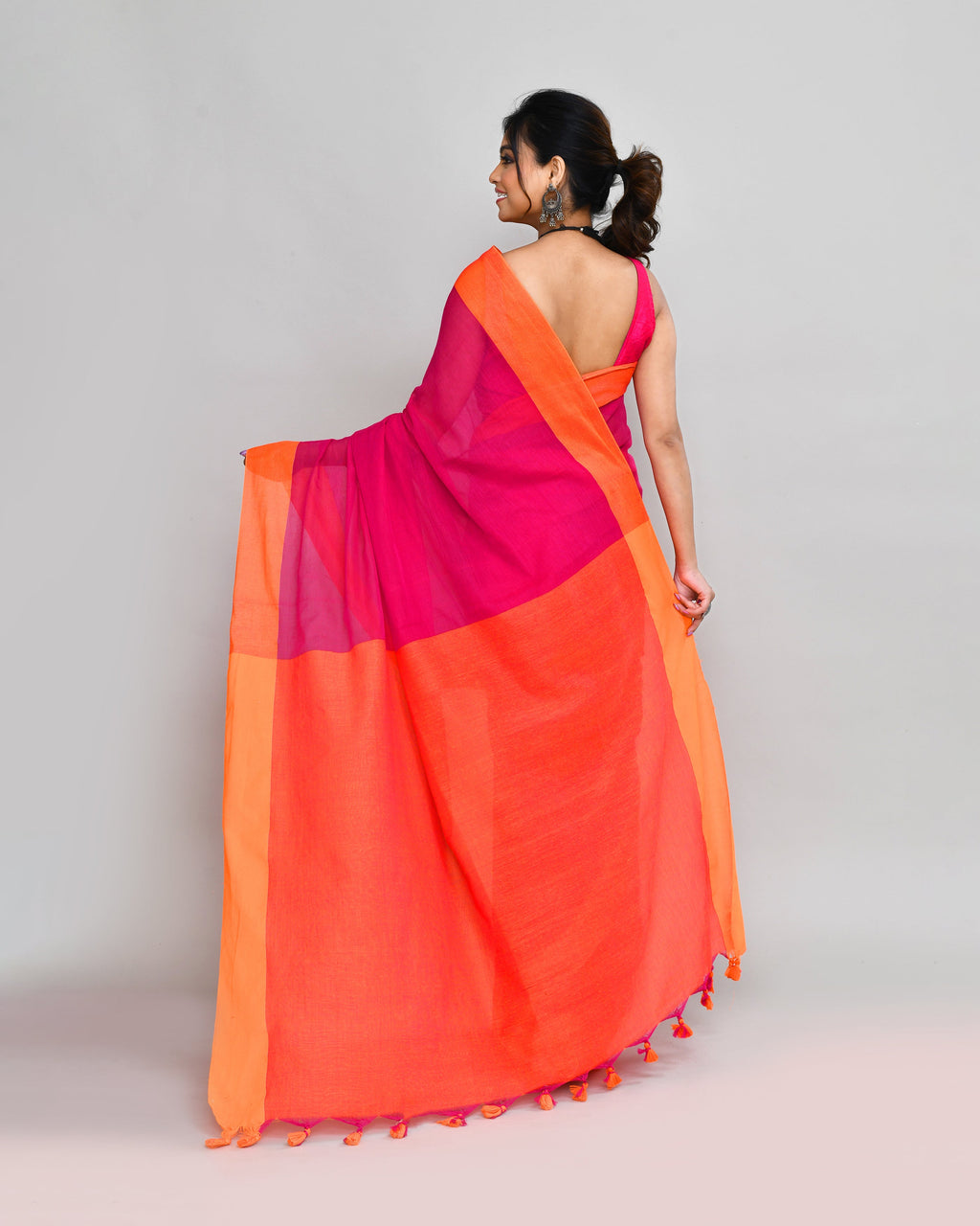 Rani Pink Cotton Saree with Orange Border and Tassel Detail