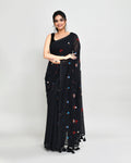 Black exclusive embroidered saree with detailed tassel embellishments on the pallu.