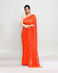 Orange red dual-tone handspun cotton saree with intricate embroidery and tassels