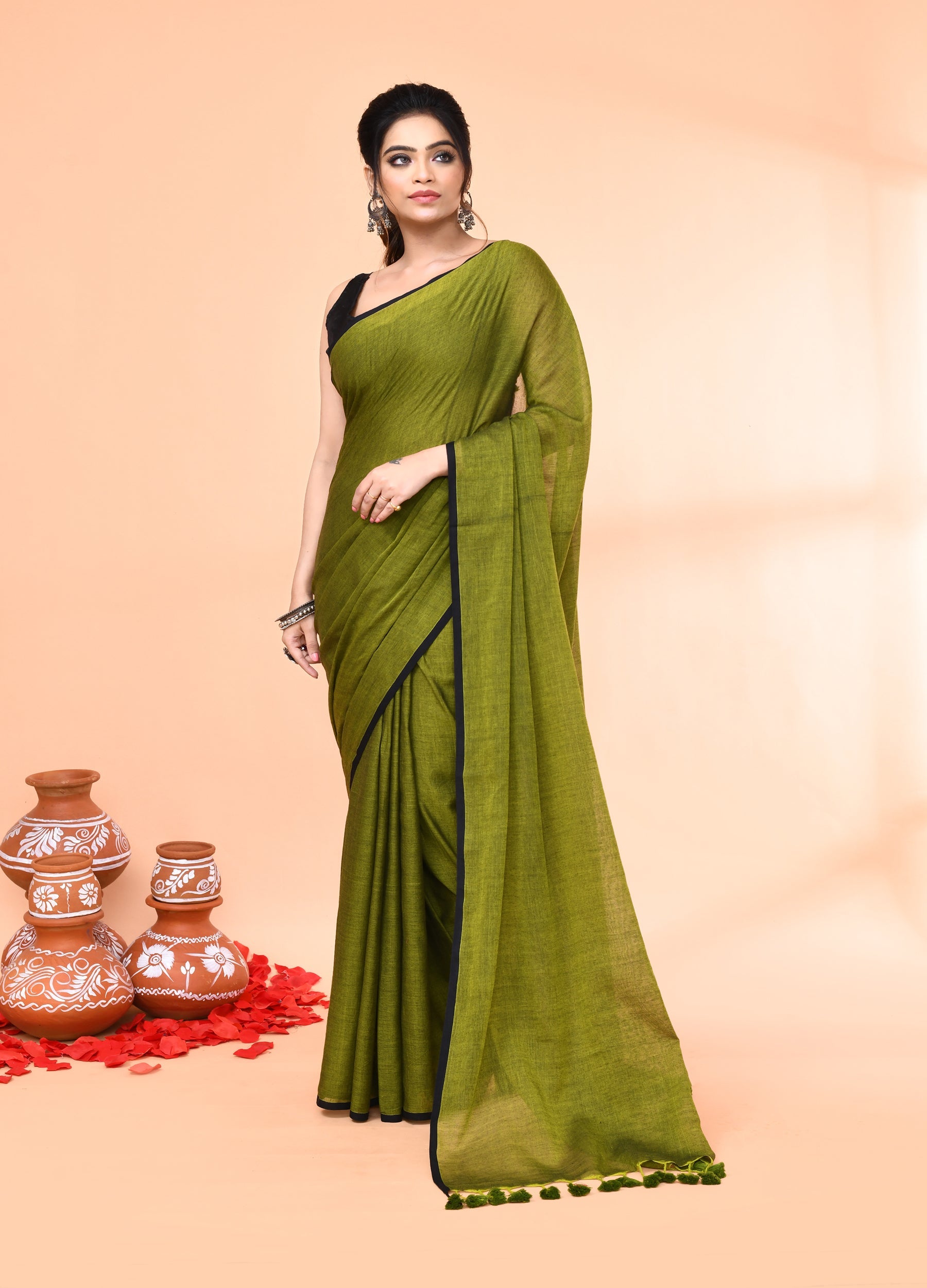 Elegant Olive Mulmul Cotton Saree featuring delicate tassel hem details.