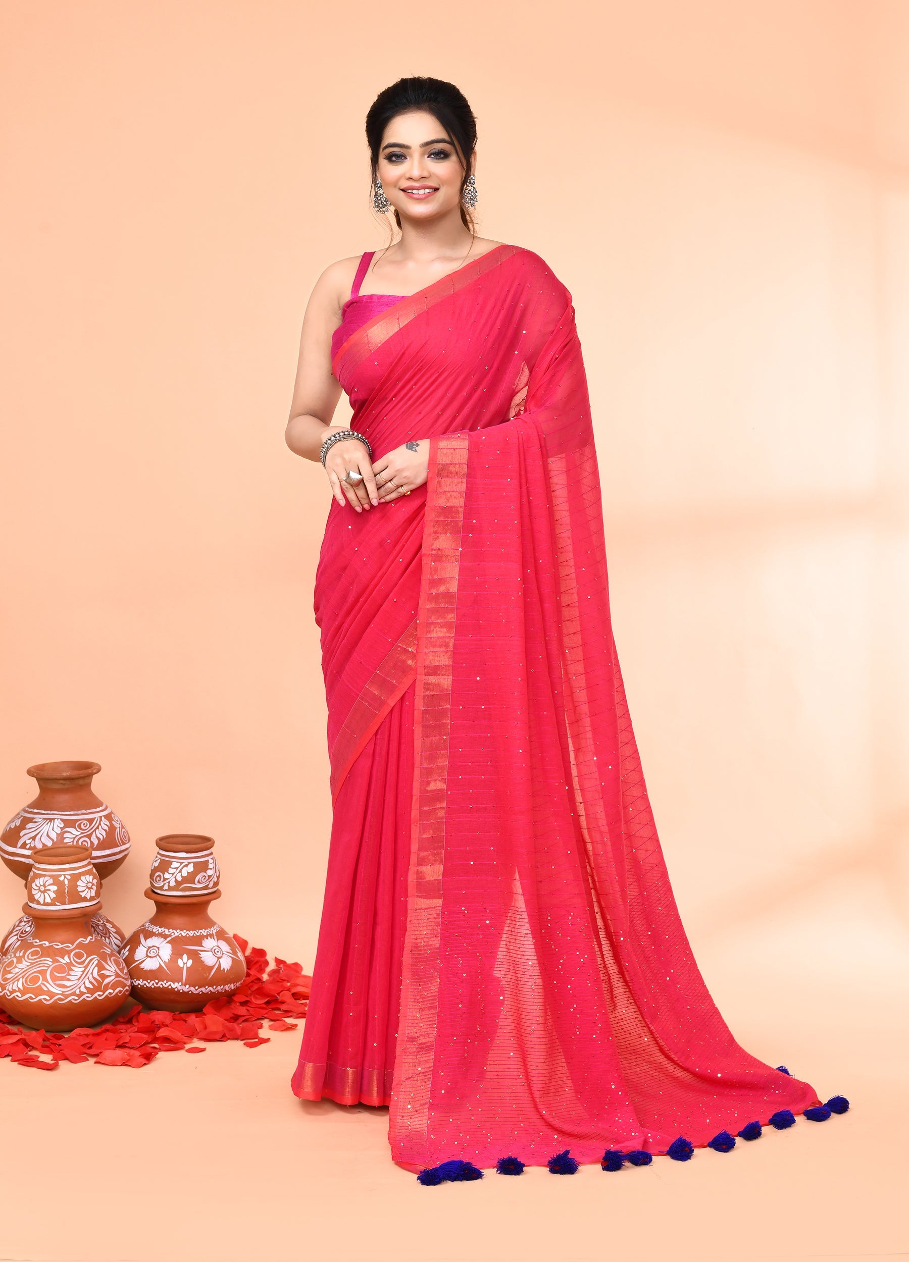 Pink cotton handloom saree featuring shimmering sequin embellishments and matching blouse