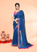 Deep turquoise cotton handloom saree with elegant sequin embellishments.