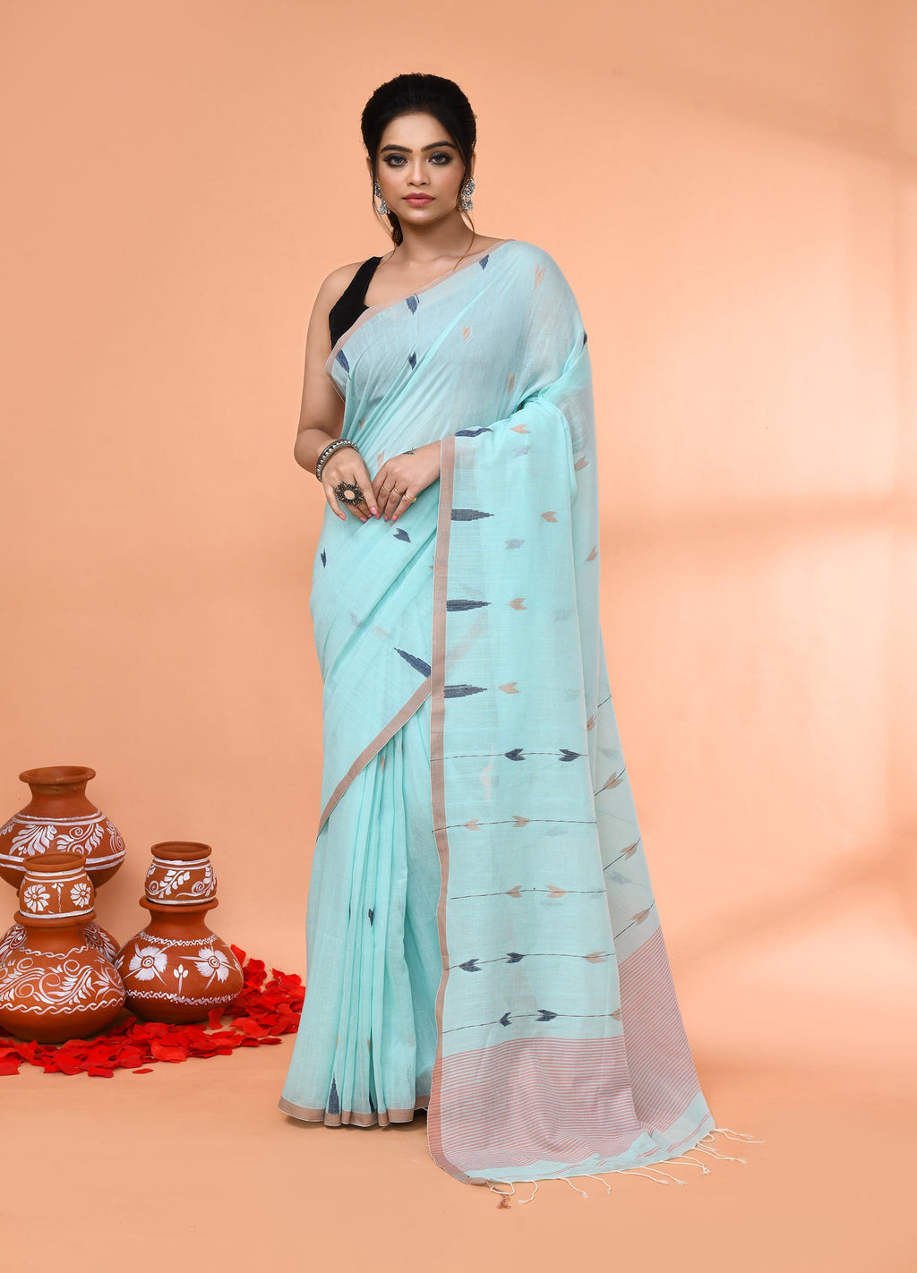 Light sky blue mul cotton jamdani saree with matching blouse piece.