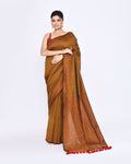 A luxurious bronze cotton saree featuring delicate sequin embellishments throughout.