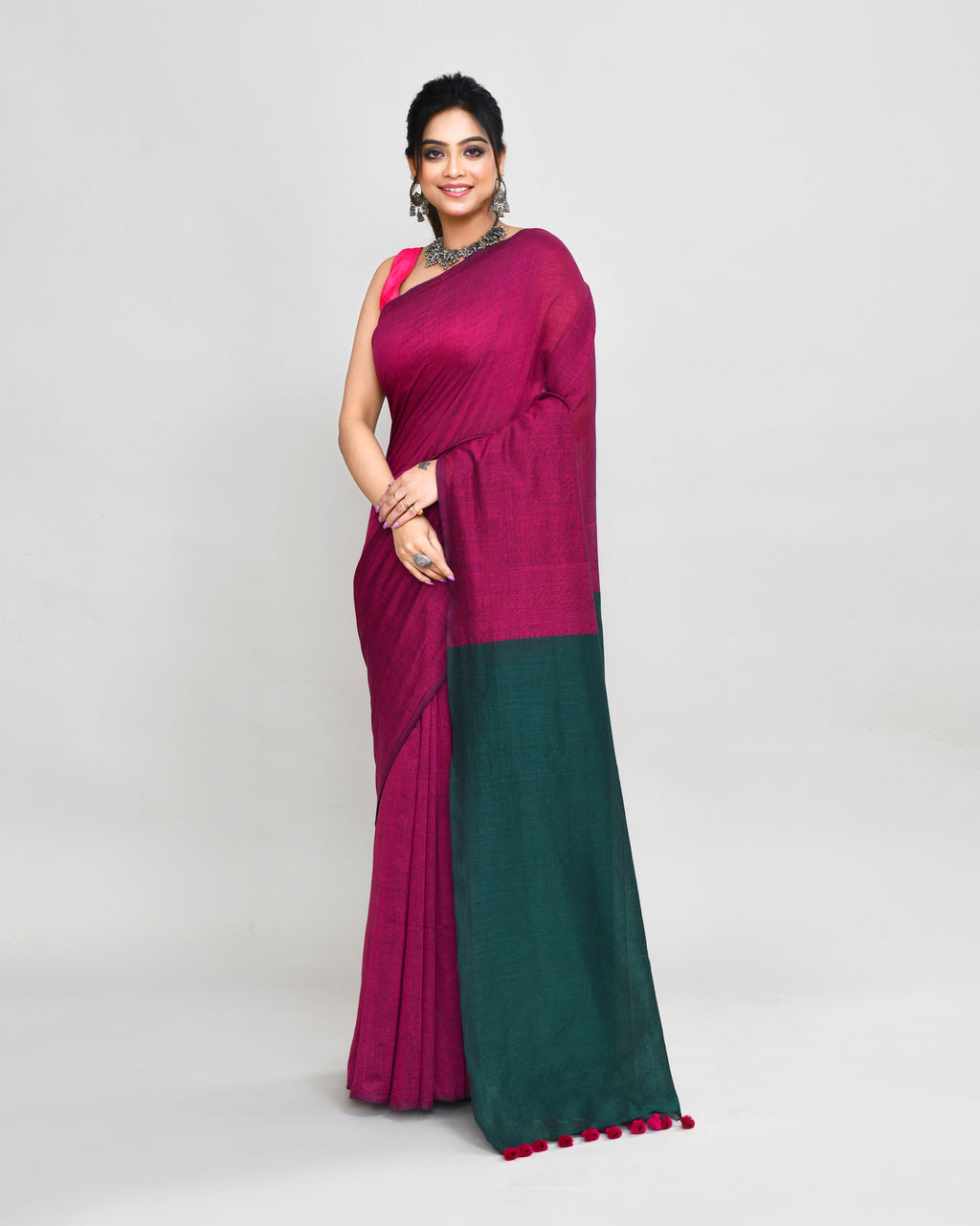 Vibrant Rani Pink handspun cotton handloom saree with matching blouse draped elegantly
