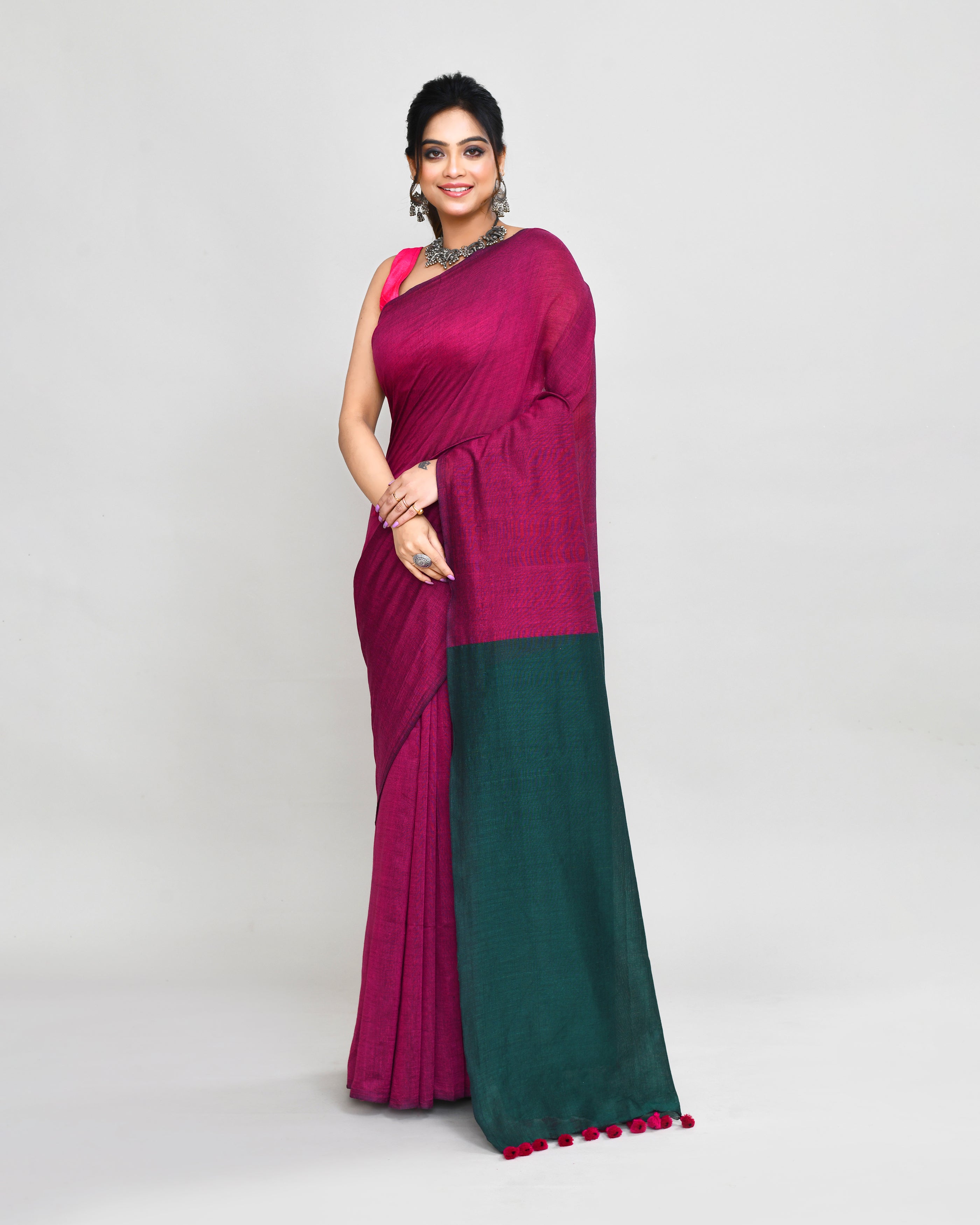 Vibrant Rani Pink handspun cotton handloom saree with matching blouse draped elegantly