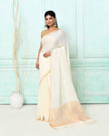 White handloom linen saree adorned with sequin work and matching blouse