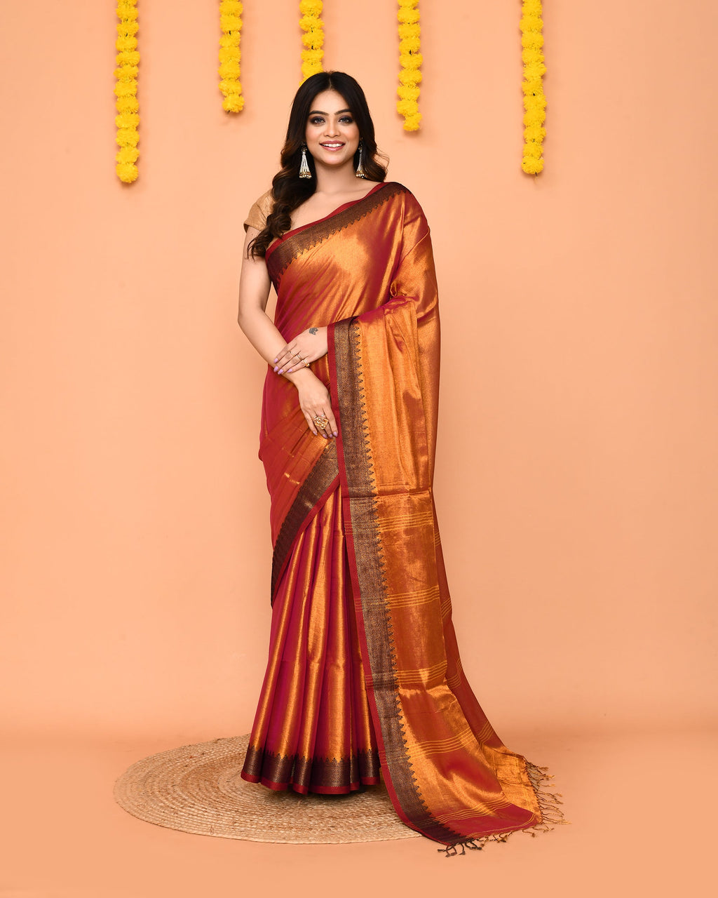 Dual tone pink and yellow handloom tissue saree with gold Zari border.