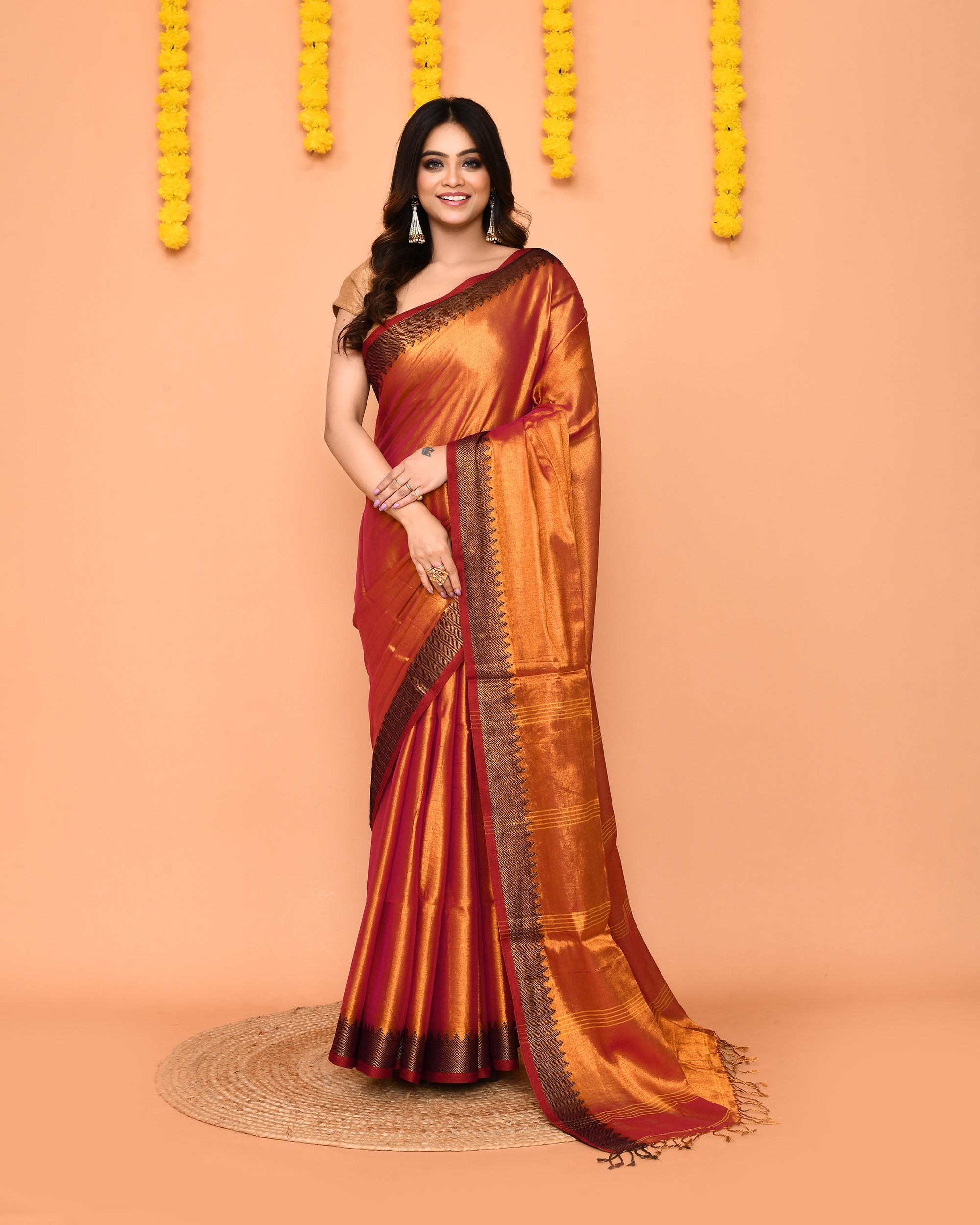 Dual tone pink and yellow handloom tissue saree with gold Zari border.