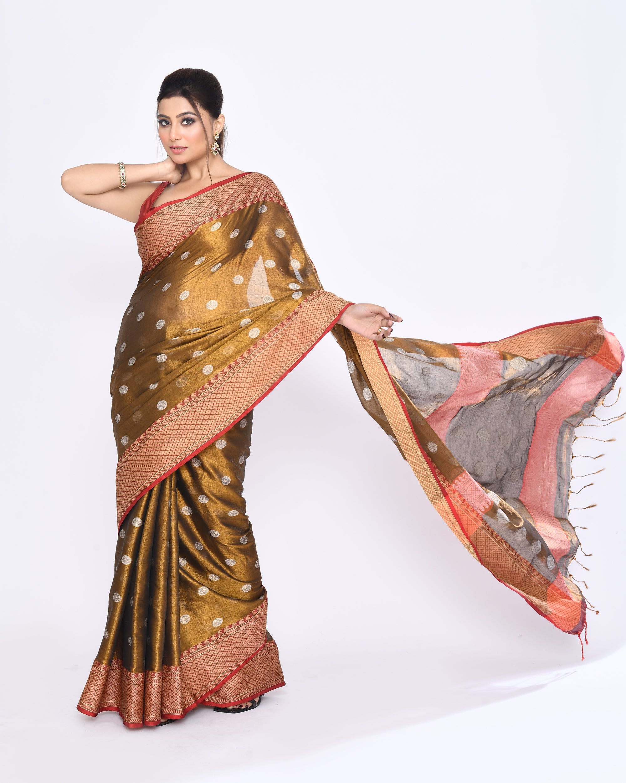 Elegant golden dual-tone cotton tissue Jamdani saree with intricate Zari work and red border details.